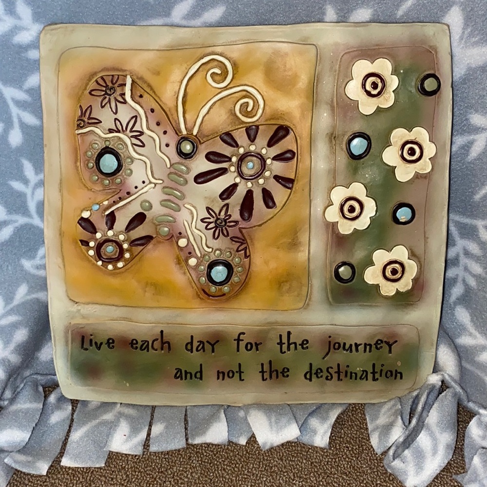 Butterfly wall hanging with inspirational message.